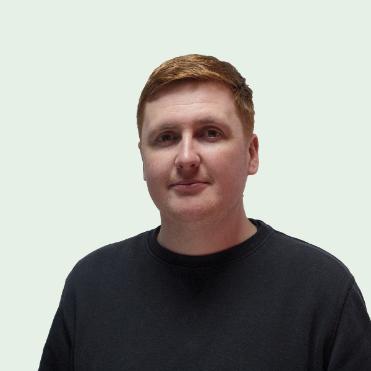 Photograph of Chris Carter wearing a black shirt.