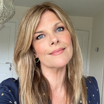 Profile photo of University of Wolverhampton alum Nikki Stratton. Nikki is wearing a blue top with gold accents.