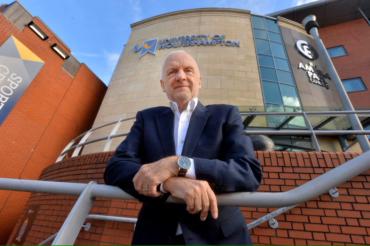 The Vice Chancellor standing outside of a University building