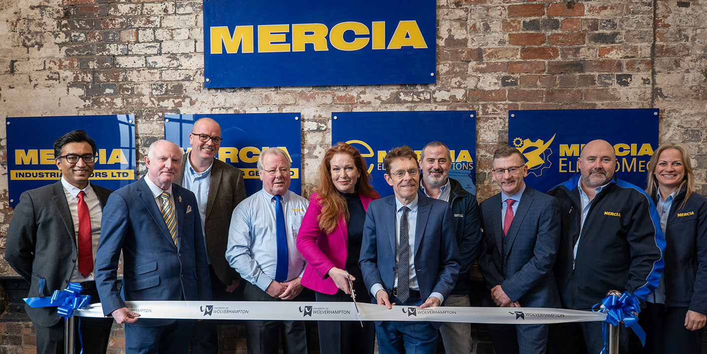 Group of academics along with Mercia staff cutting a ribbon