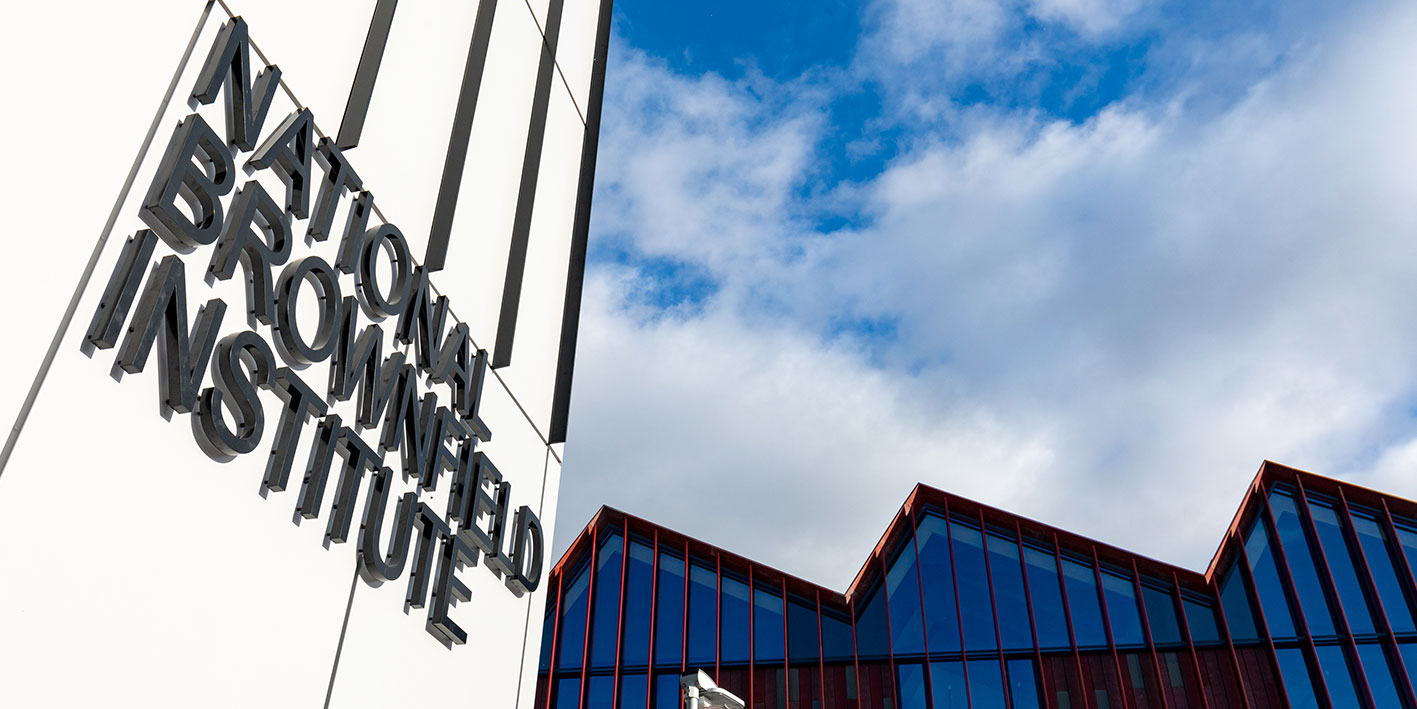 Side angle view of the National Brownfield Institute sign