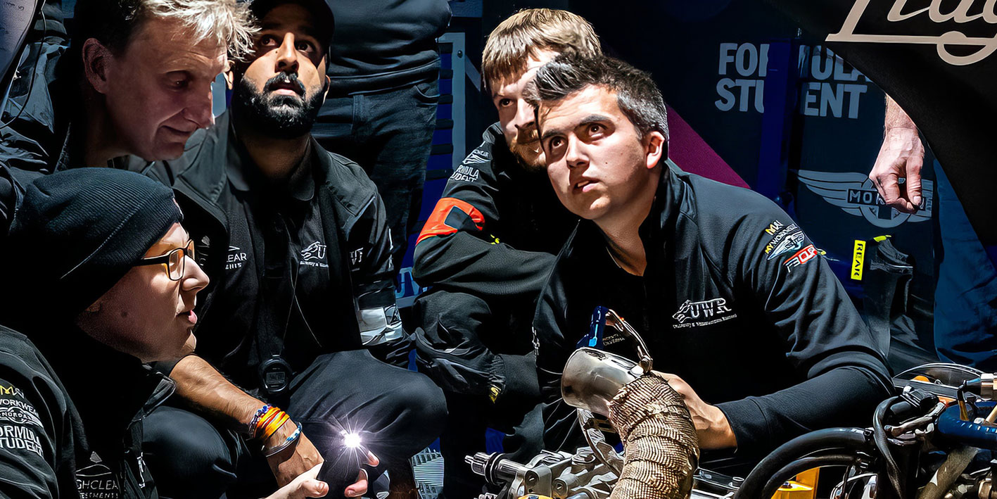 Photograph of UWR race team students in the pit lane