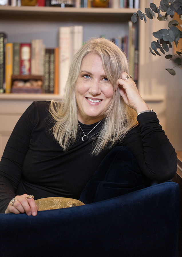 A portrait shot of author of this new book Elaine Kasket smiling at the camera