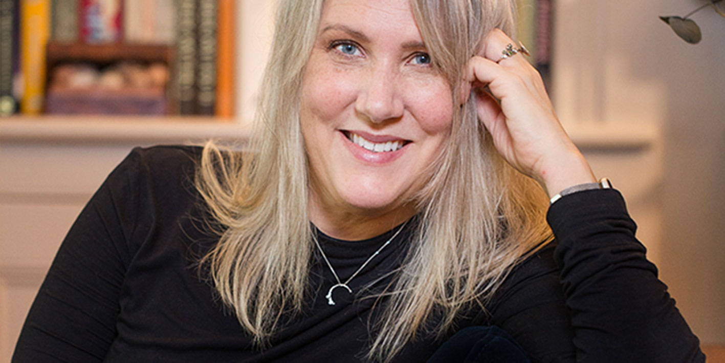 A portrait shot of author of this new book Elaine Kasket smiling at the camera