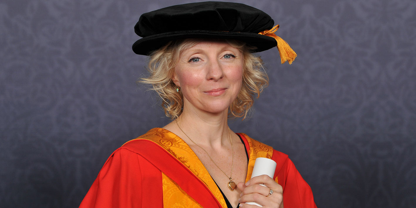 Landscape image of Honorary Graduate Liz Berry with her award