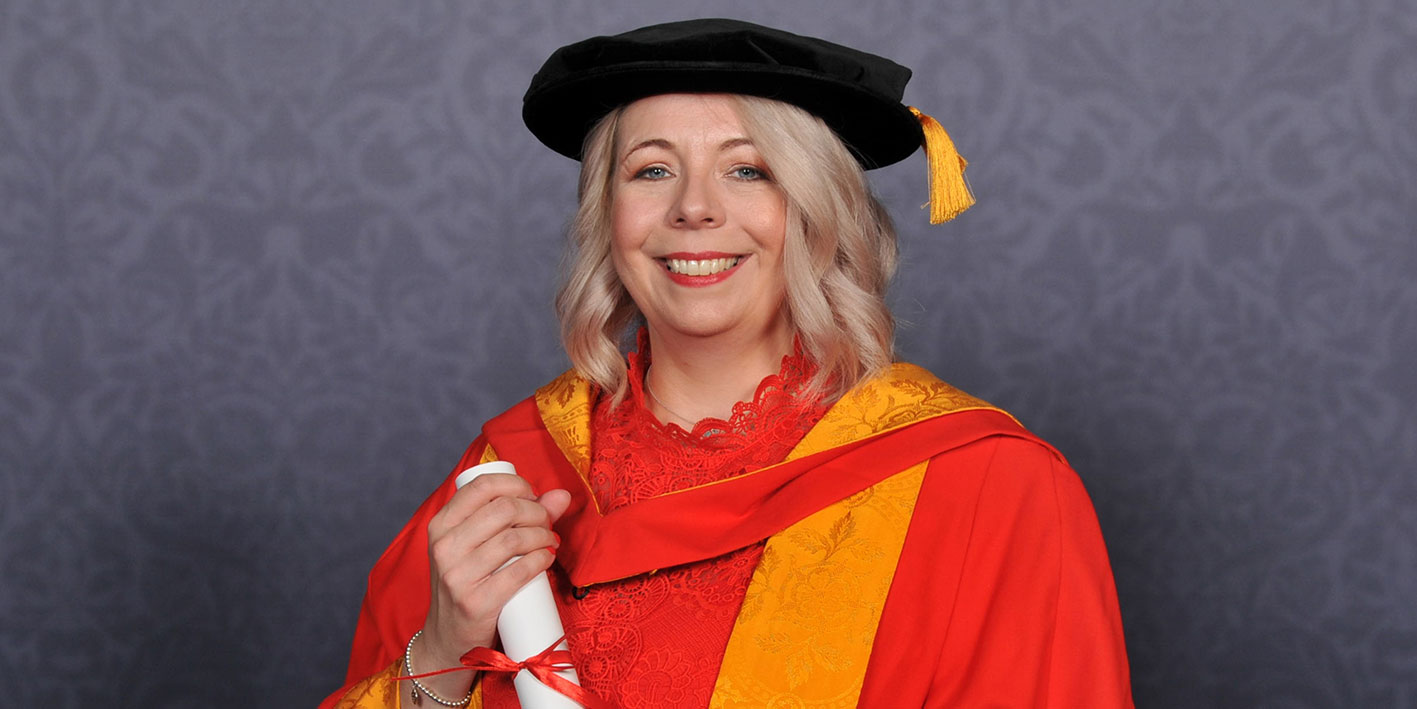 A portrait of Clare Roberts-Molloy with her award
