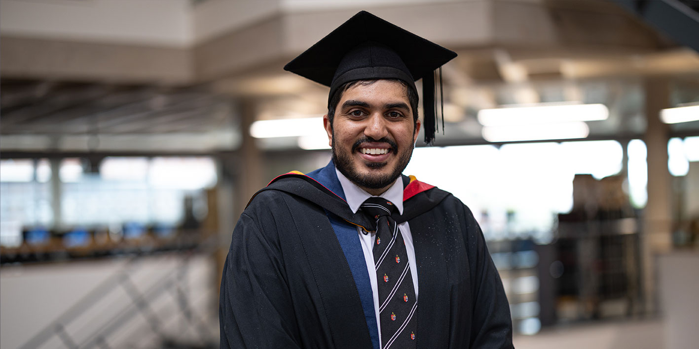 A portrait of Herjeavan Singh Tagger holding his certificate