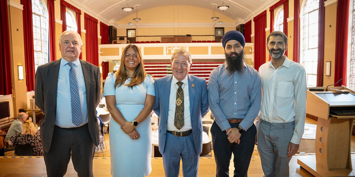 Partners attending the suicide prevention group looking at the camera