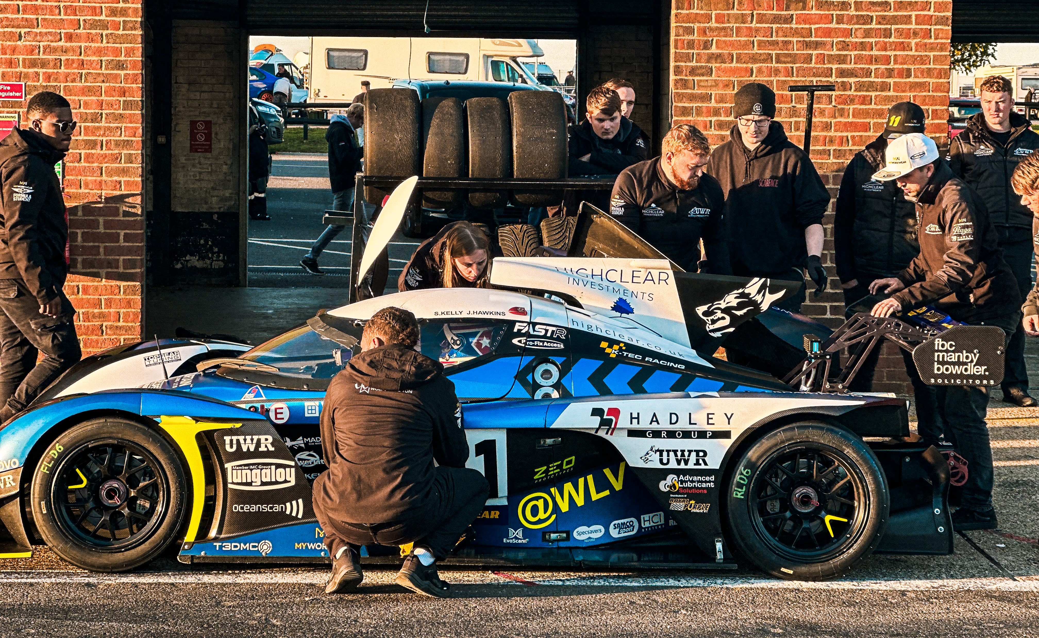 UWR team of students preparing a race car trackside
