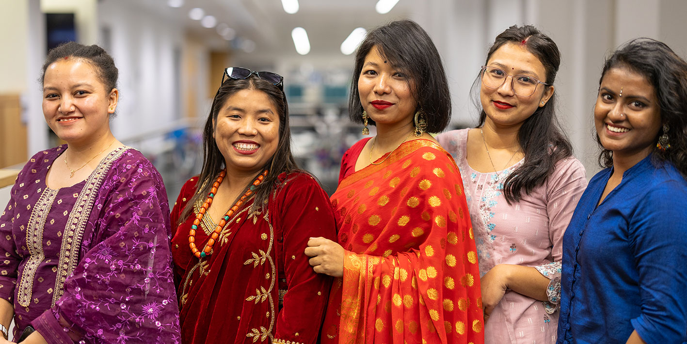 A group of Business Management International students lined up to celebrate Diwali