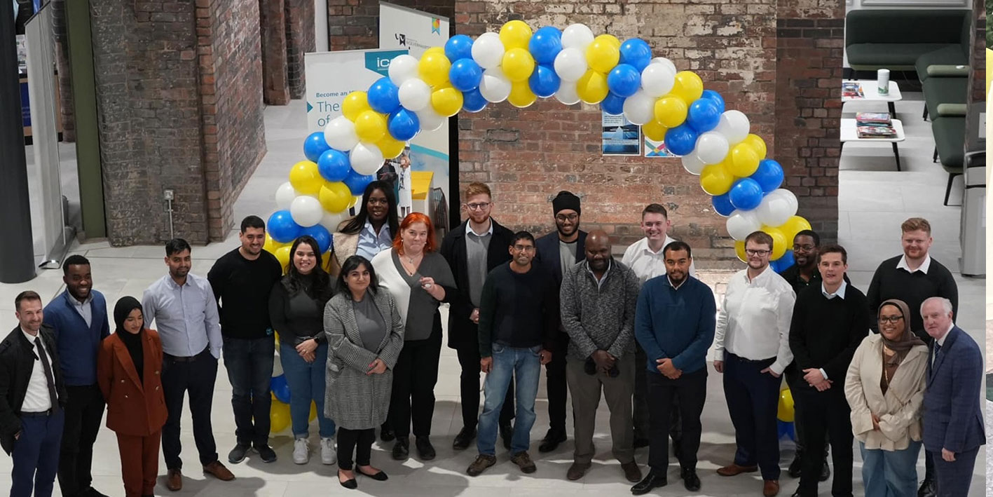 A group of Civil Engineering graduates looking at the camera