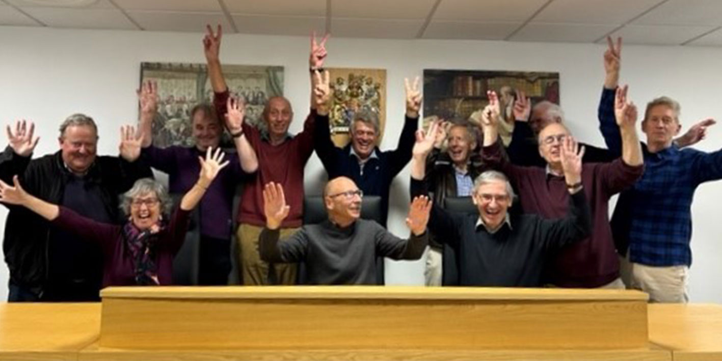 A group of visiting Law graduates in the School of Law court