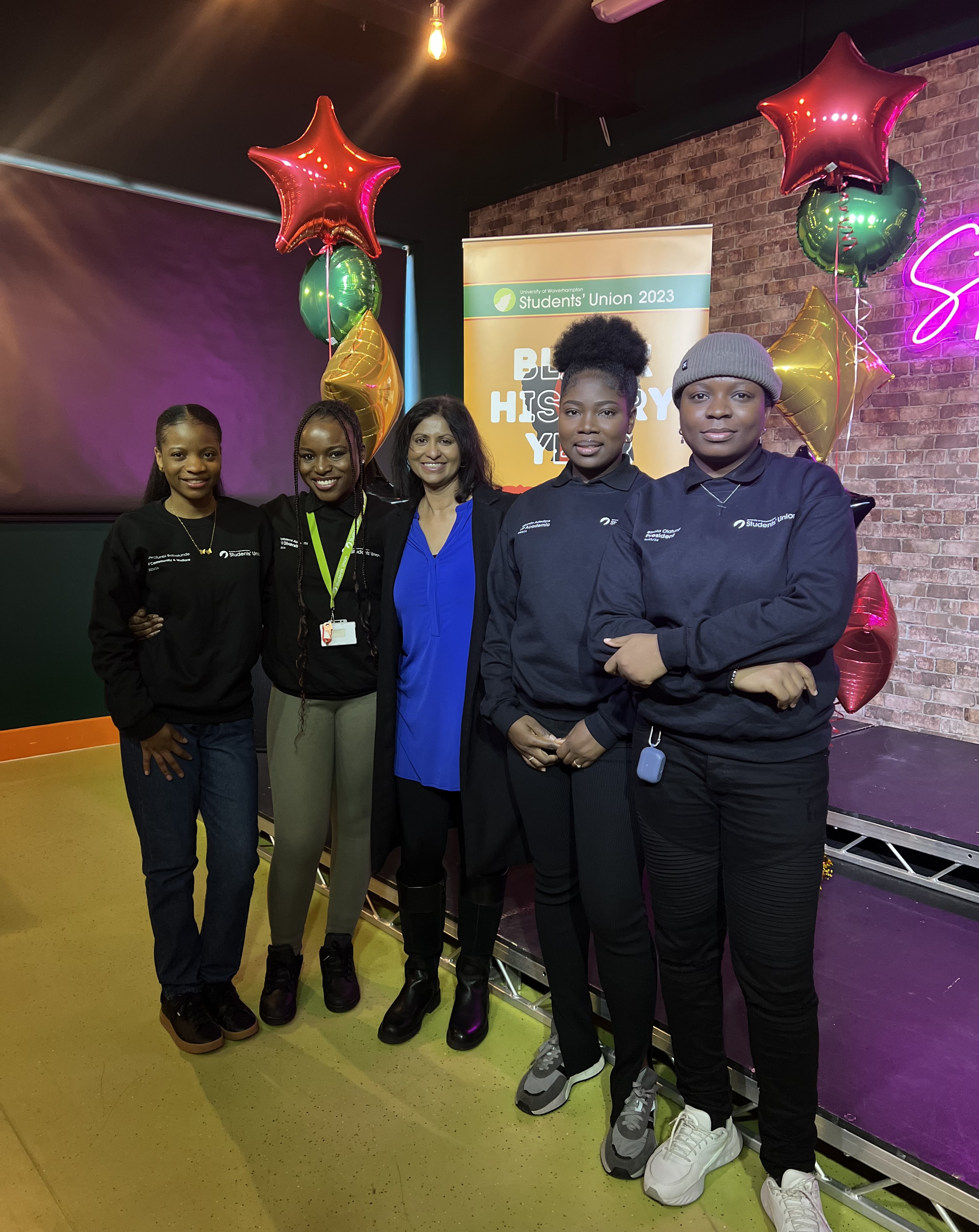 A group of Black History Conference organisers look at the camera