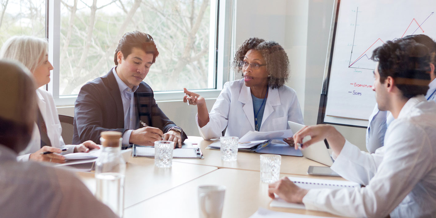 An iStock image of health leaders round the table