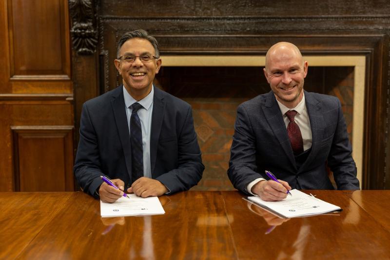 The Vice Chancellor and a representative from West Midlands Police sign a partnership agreement