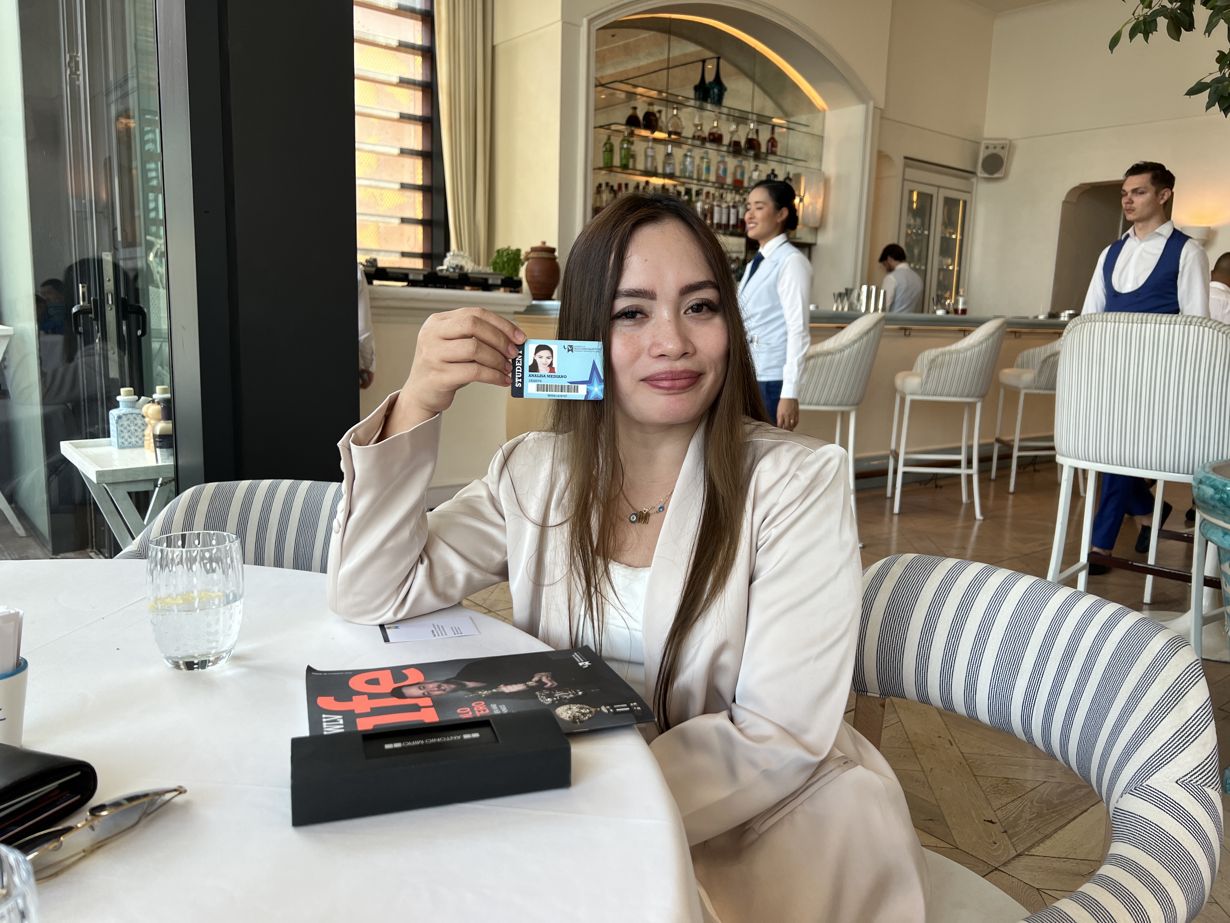 Notable alumnus in Dubai showing her student ID Card