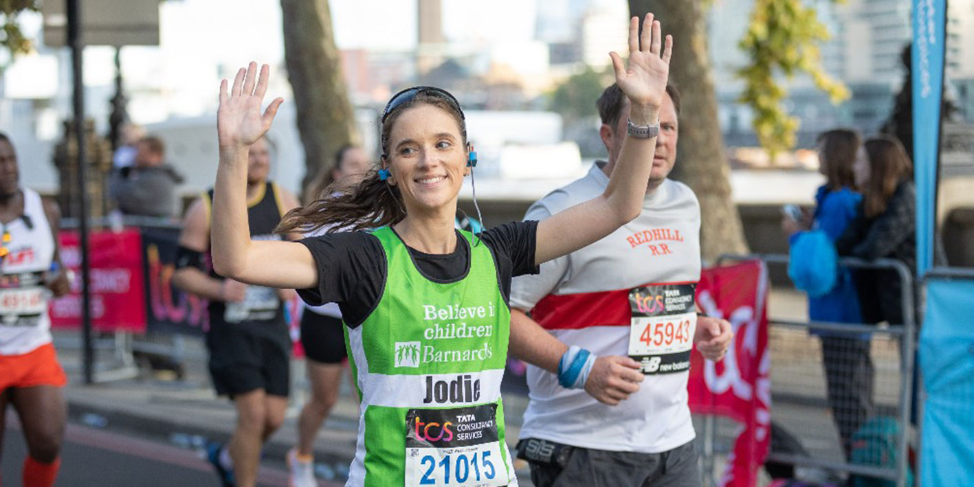 Student crossing the finishing line in London Marathon