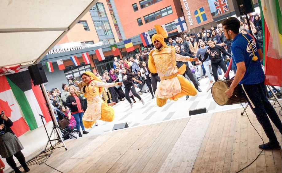 Photograph of dancers taken from on stage at the International fair