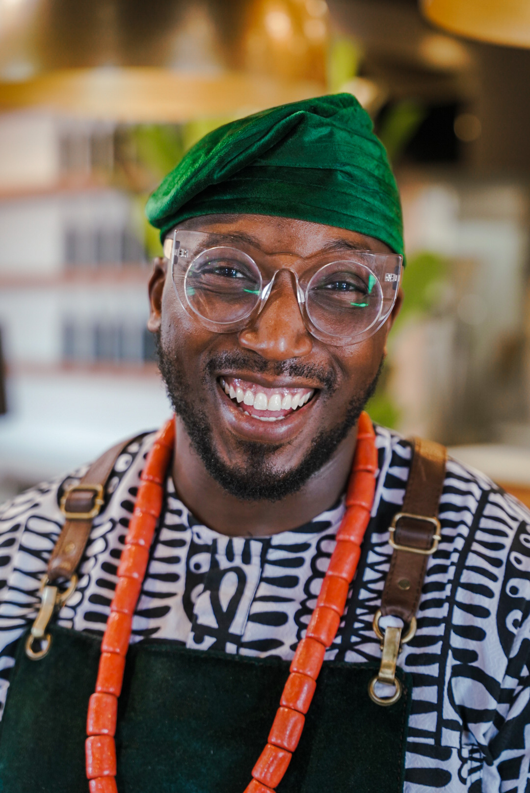 Portrait picture of graduate in his kitchen