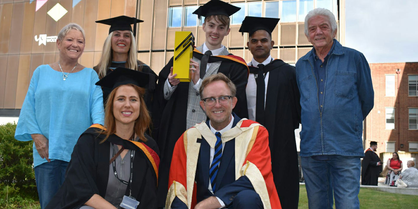 Matt Palmer's family with winning graduate of the Matt Palmer Award in the courtyard