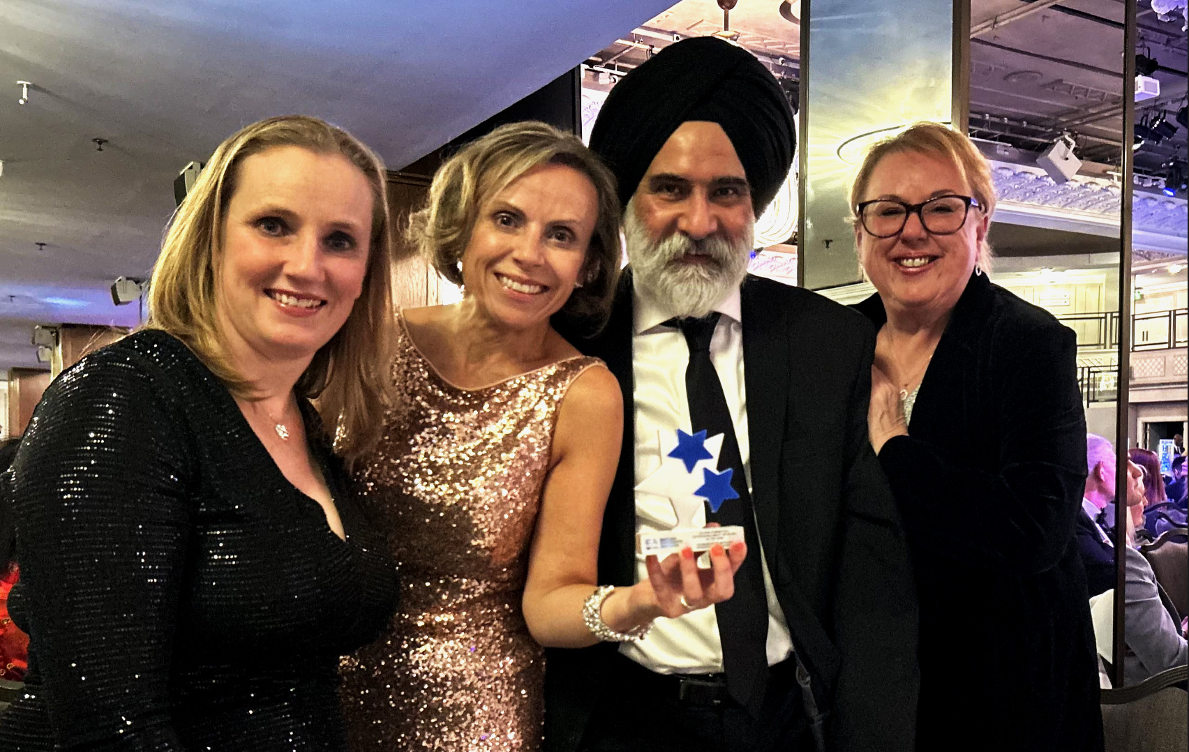 Group photo of DSN and EDI teams with award for Outstanding Ability Network at the British Diversity Awards