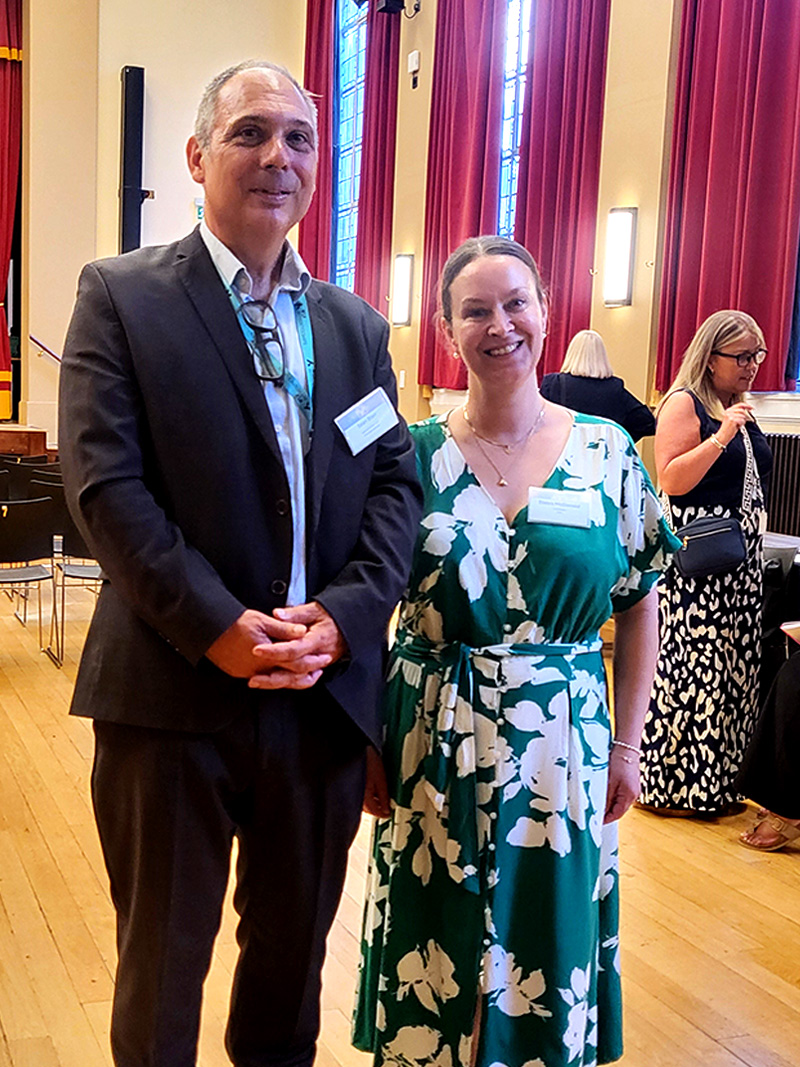 Two attendees at the Strategic Leadership and Management training course celebration event