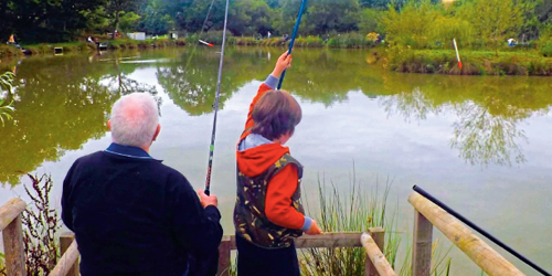 man and boy fishing in a lake for mental health