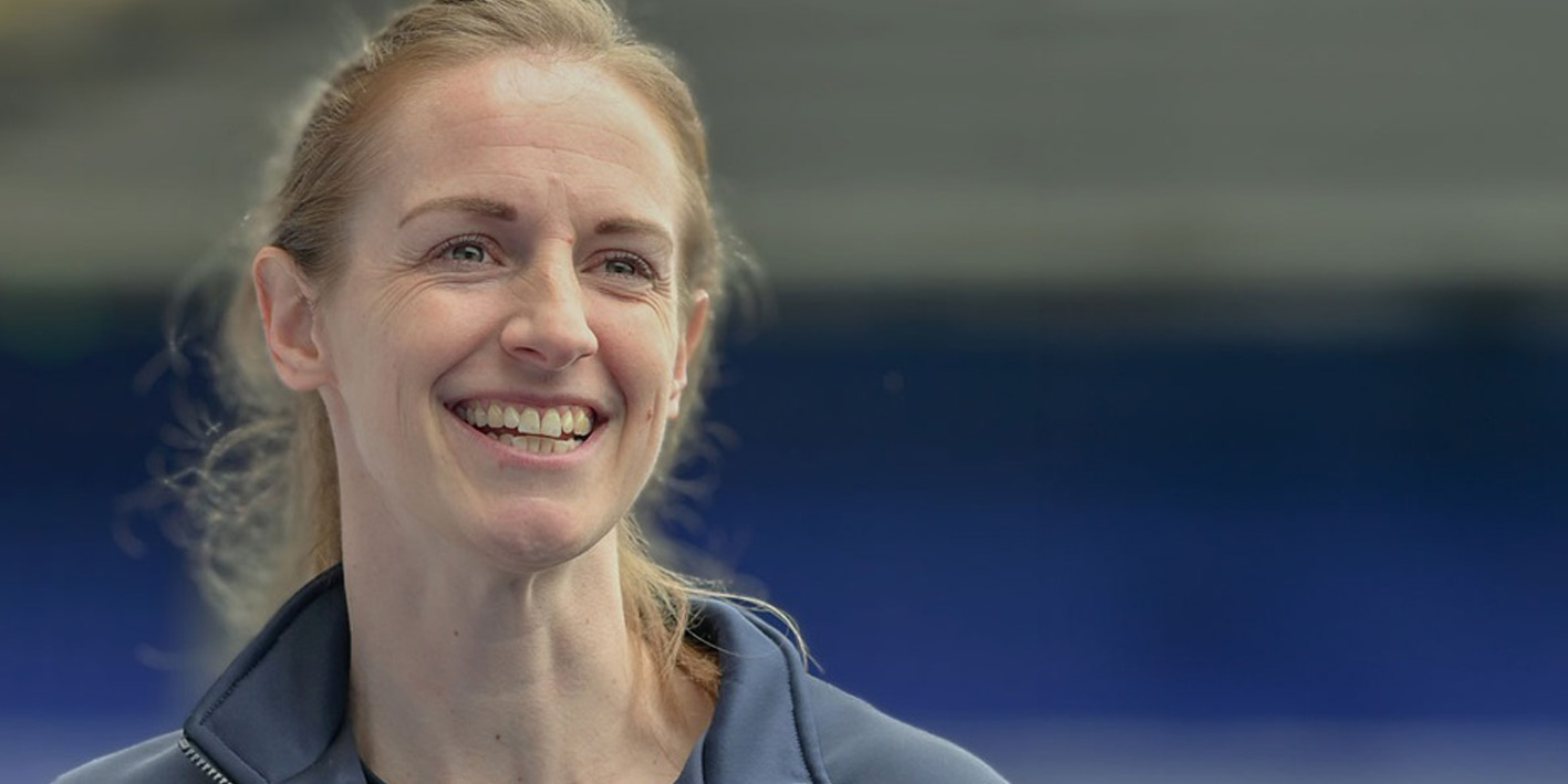 close up smiling portrait of Kerys Harrop, Lecturer in Football Coaching and Performance