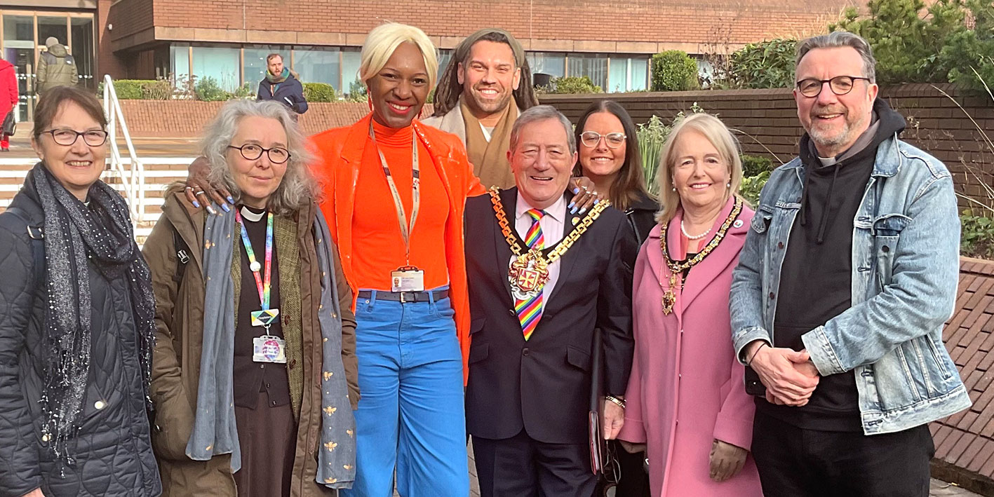 A group of people posing for the camera at the Wolverhampton LGBTQ+ flag raising ceremony