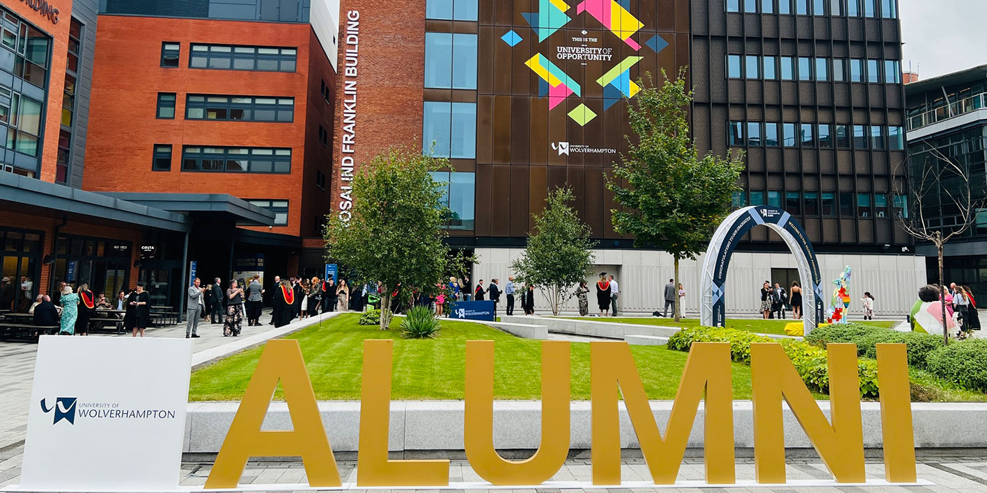 A picture taken in the City Campus courtyard with big WLV Alumni letters to celebrate graduation