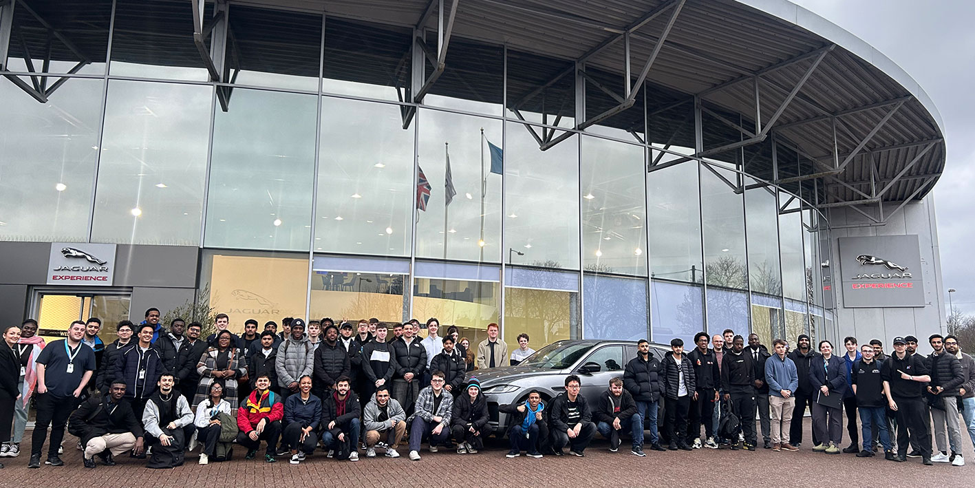 A group of engineering students outside JLR car plant in Birmingham