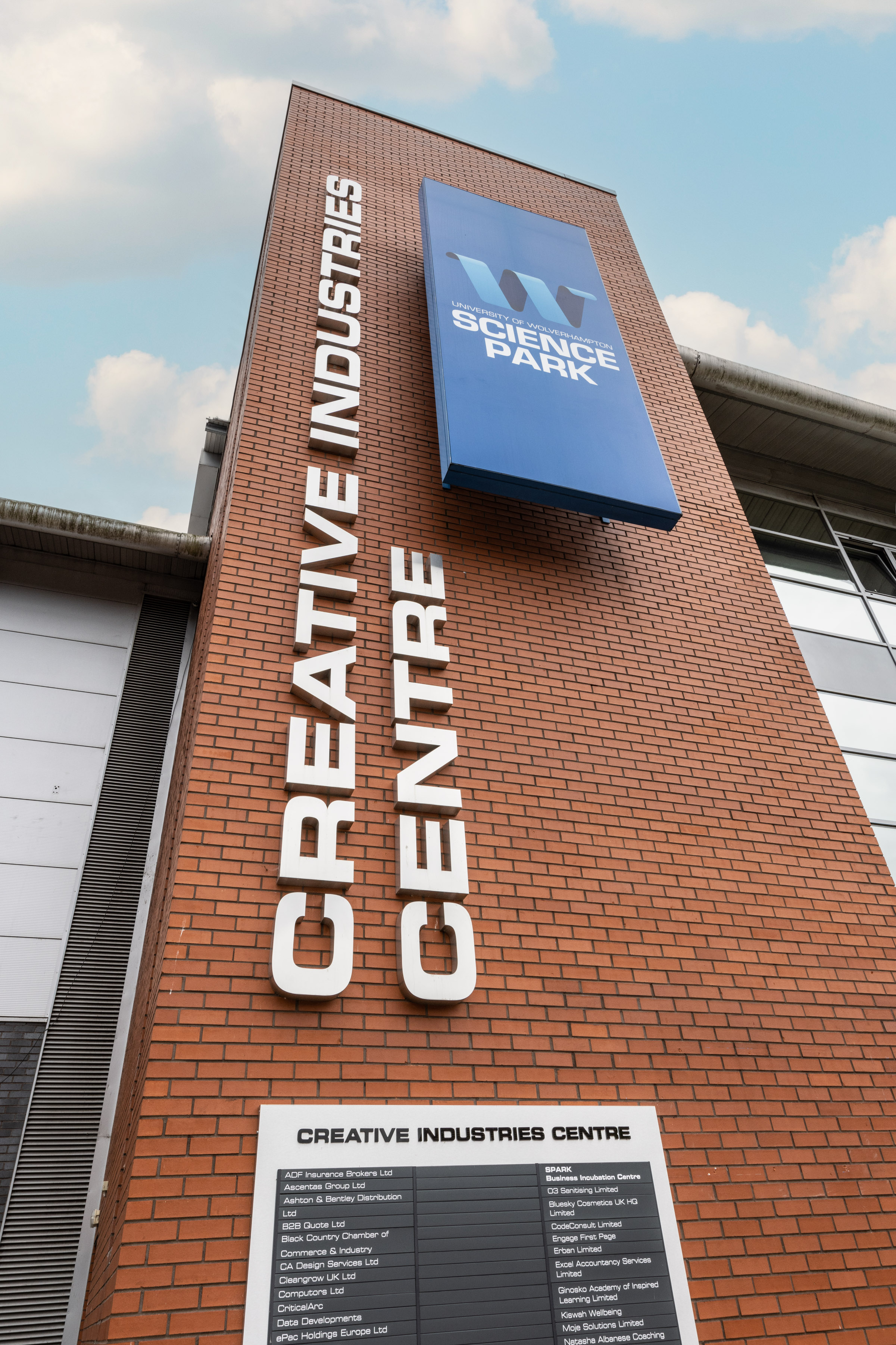 A portrait of the Creative Industries Centre signage at the Science Park