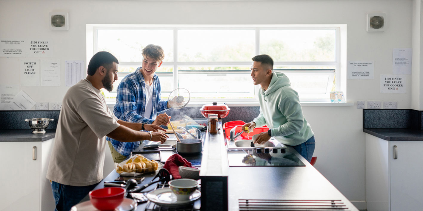 Students cooking in a communal kitchen