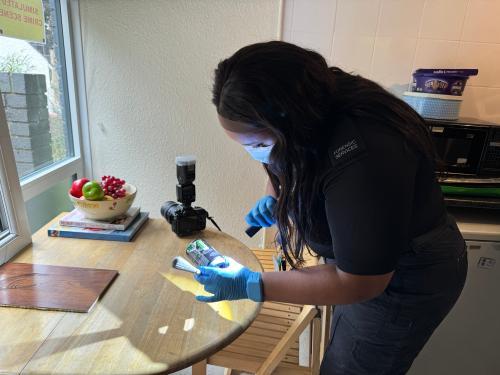 Student examines a table forensically