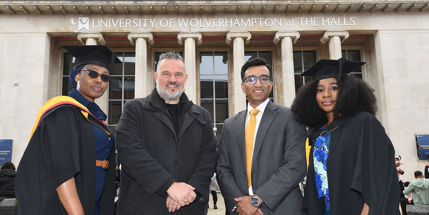 CEO of AEG and Pro Vice Chancellor Prashant Pillai outside The Halls with two graduates