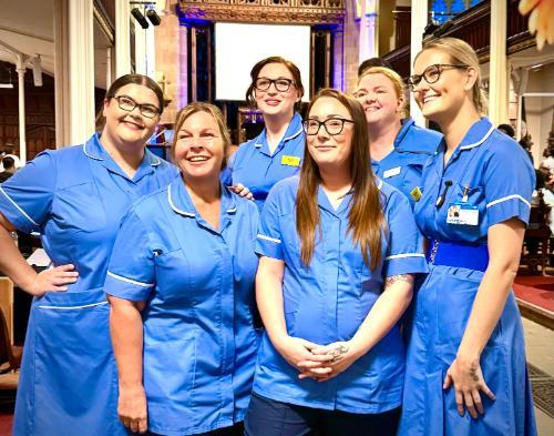 Nurses celebrating at their nurse badging ceremony