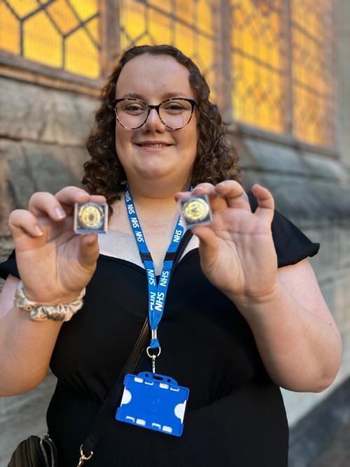 A nurse celebrating at her nurse badging ceremony