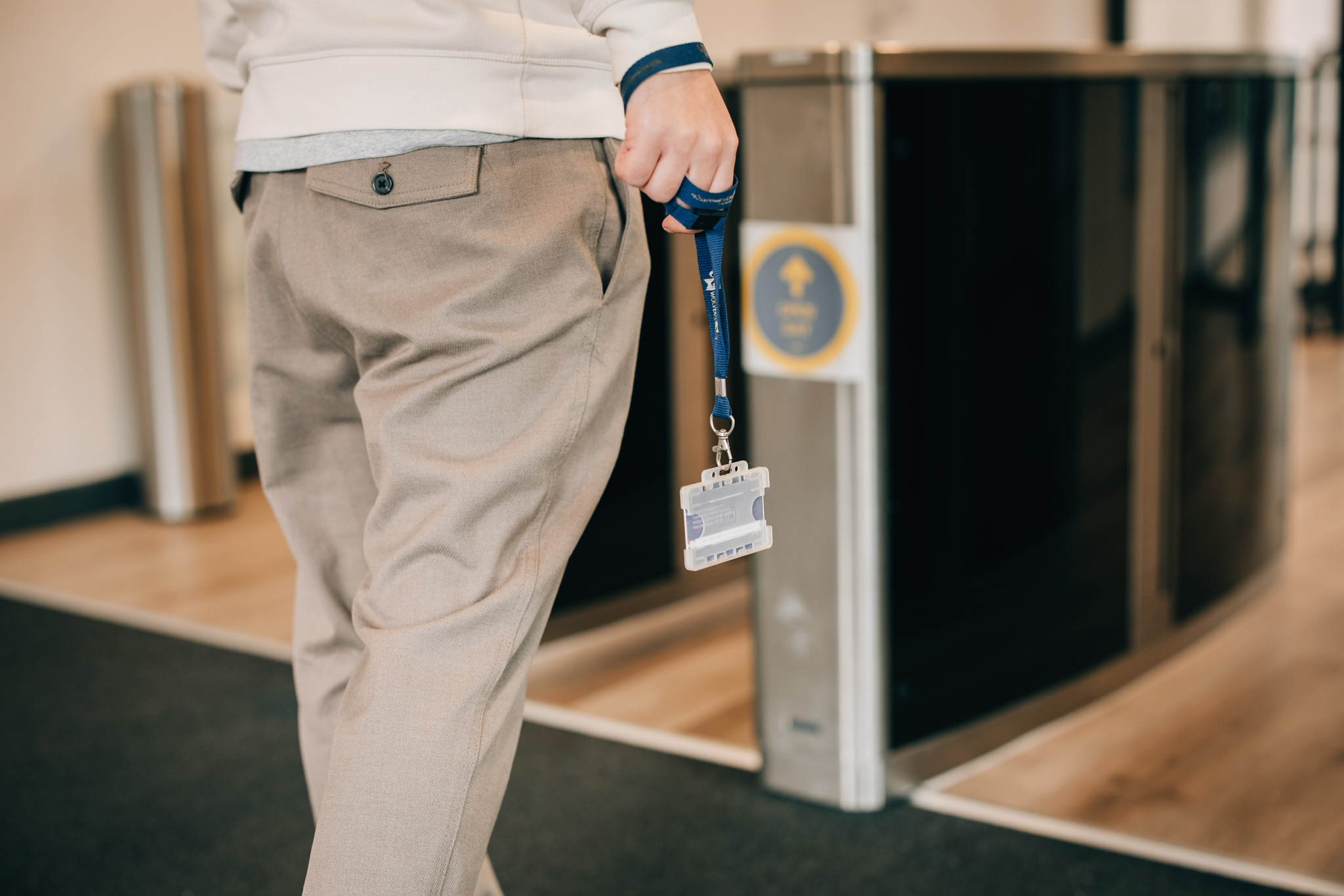 An image of someone approaching a barrier with their ID Pass