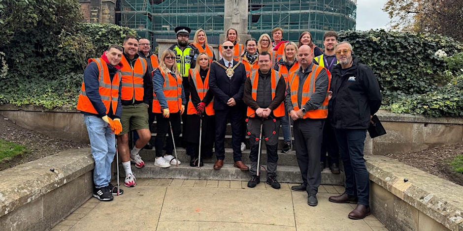Autumn litter pick group photo of volunteers in high vis vests with the Mayor