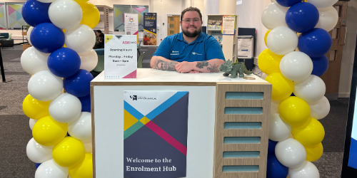 A student Ambassador manning the City Campus Enrolment Hub in the Student Life Centre