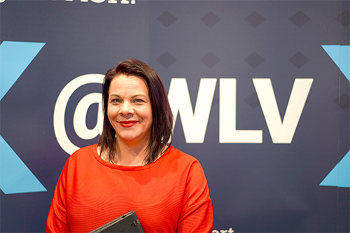 Francesca Coxon in from of ASK@WLV backdrop