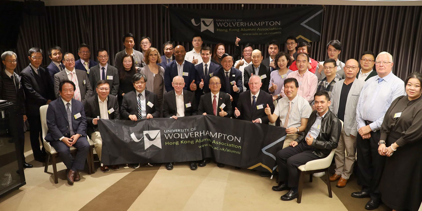 Photograph of a group of Hong Kong alumni from the University of Wolverhampton seated together at a reunion event.