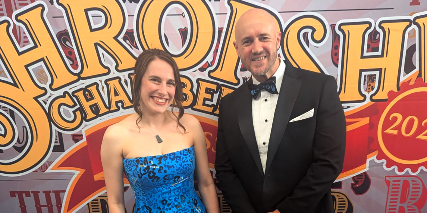 Lauren Chandler, Sales Office Manager at MyWorkwear modelling fashion student Hannah De Haan's design at the Shropshire Chamber Business Awards
