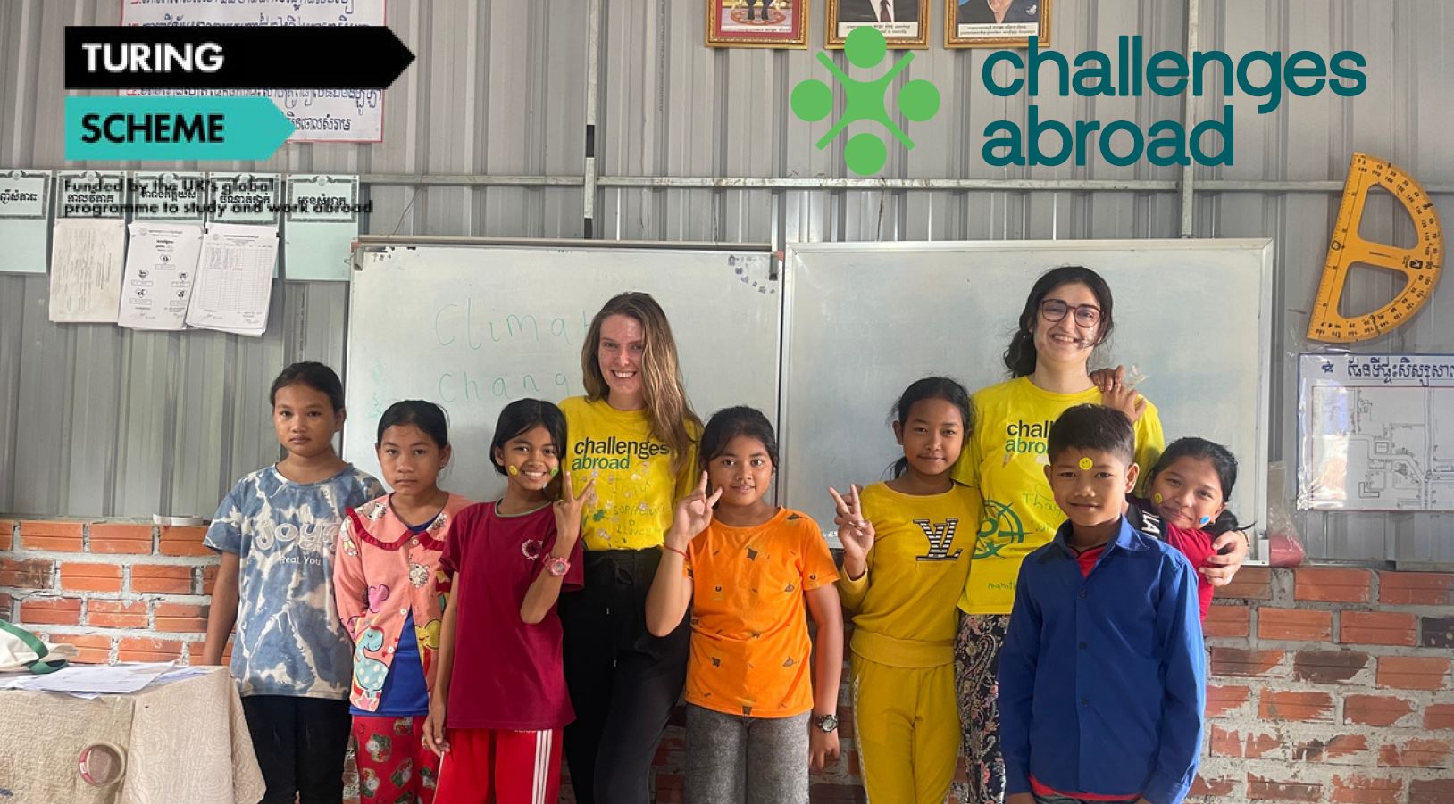 group photograph of smiling children and student volunteers