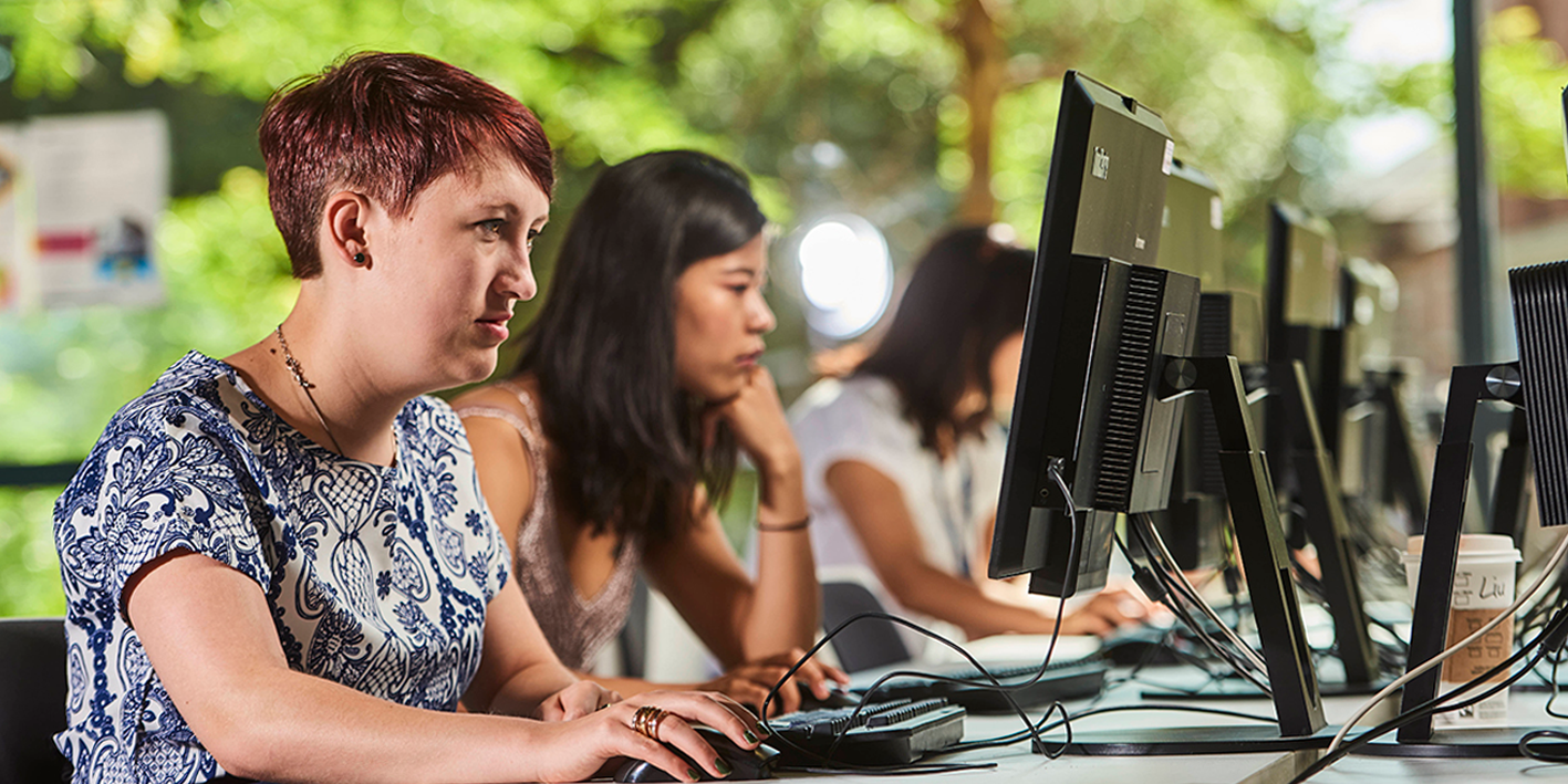 a row of students using on campus student PCs