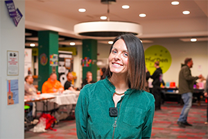 Dr Clare Dickens smiling wearing a green dress