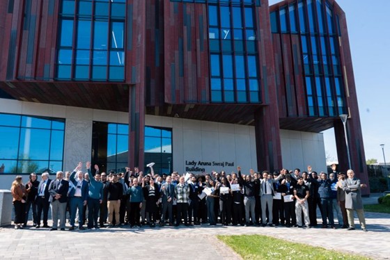 A group of students in front of a building