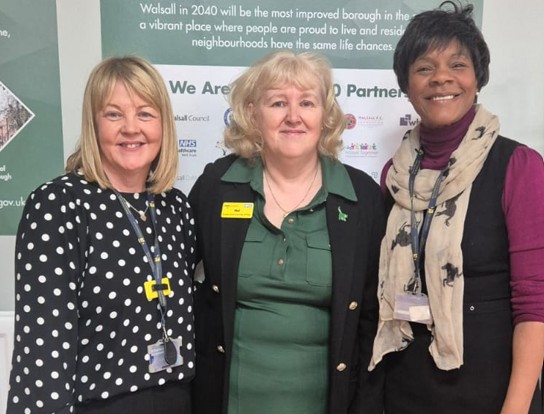Three women standing together