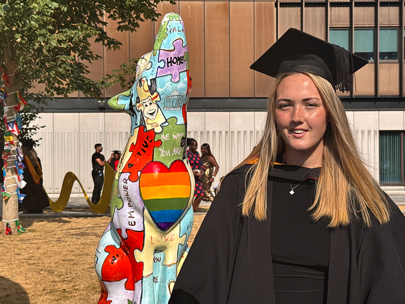 Madi Highfield Football Coaching and Performance graduate in courtyard