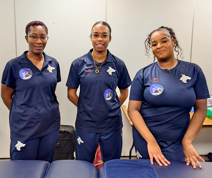 Three Sport and Exercise Therapy students on work experience at Jason Derulo concert